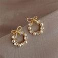 Pendientes de lazo y perla circular