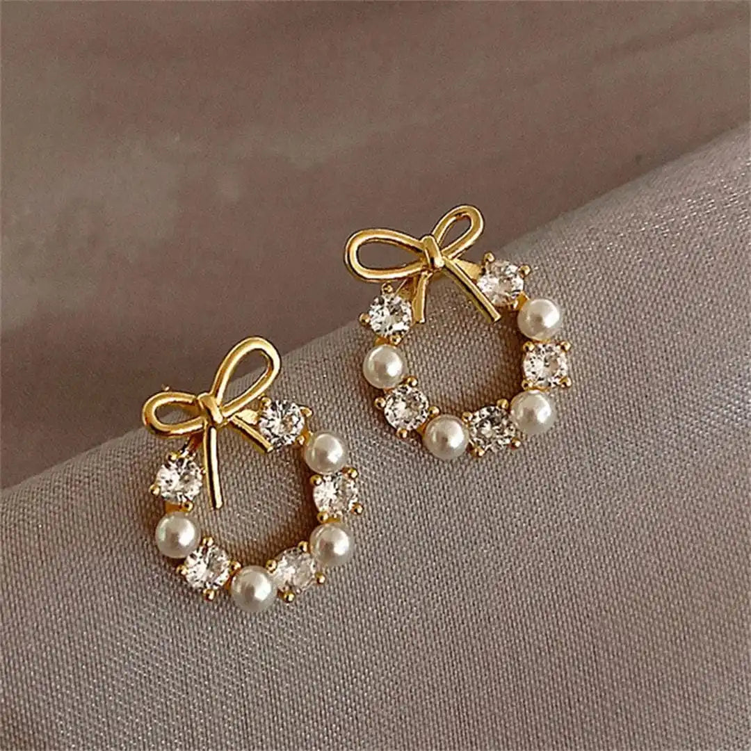 Pendientes de lazo y perla circular