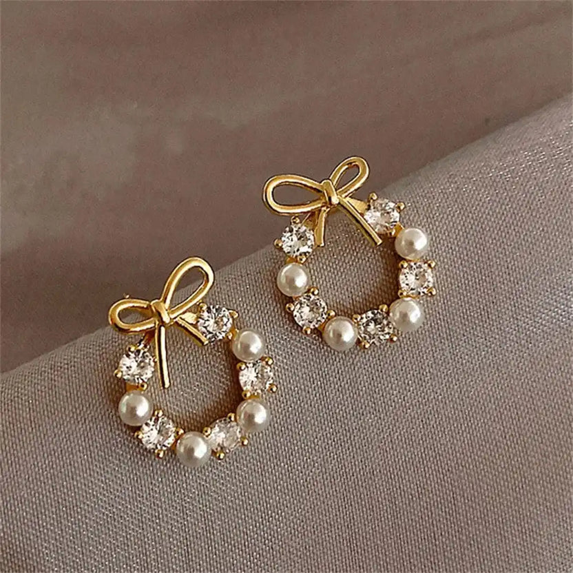 Pendientes de lazo y perla circular