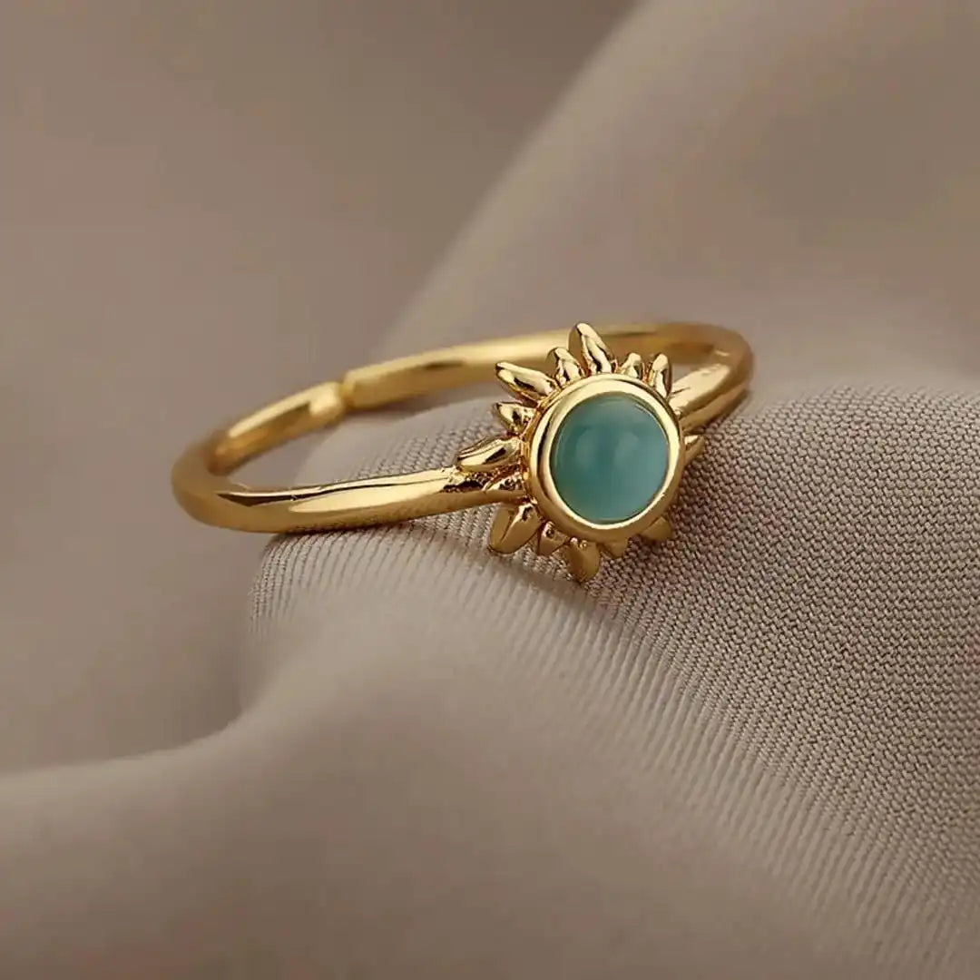 Anillos de ópalo con sol en oro y plata
