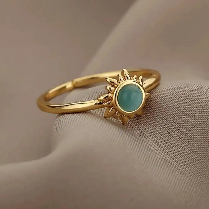 Anillos de ópalo con sol en oro y plata