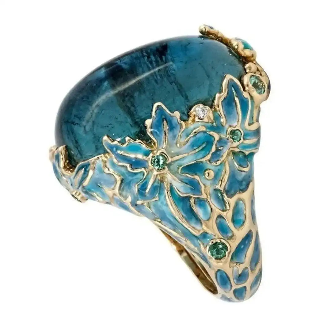 Anillo elegante de oro con flor y piedra azul – imagen 2