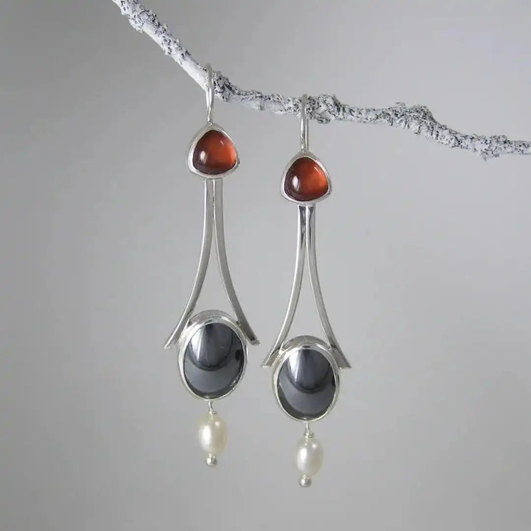 Pendientes colgantes de plata con perla y tres piedras