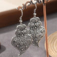 Pendientes encantadores de hoja plateada