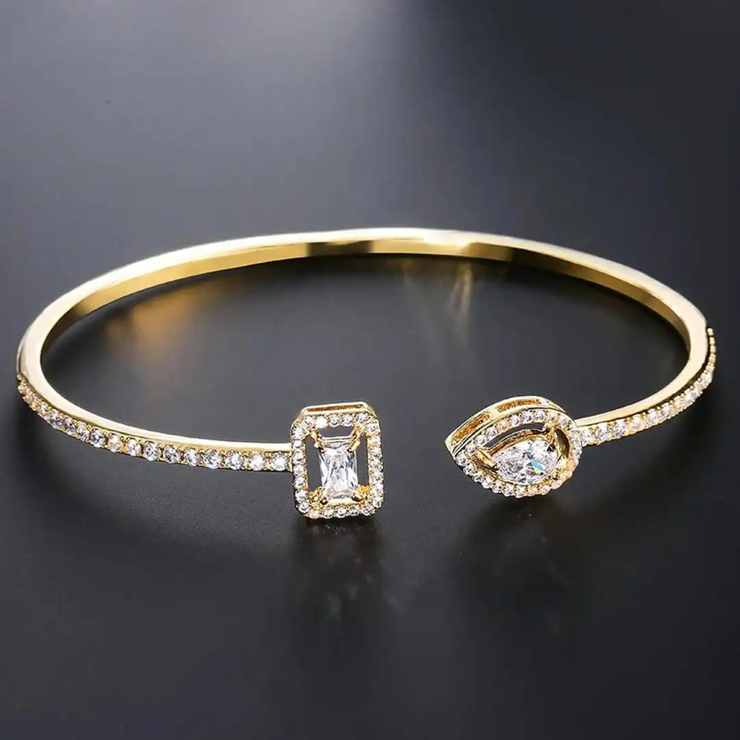 Pulsera rígida abierta de oro con dos piedras – imagen 4