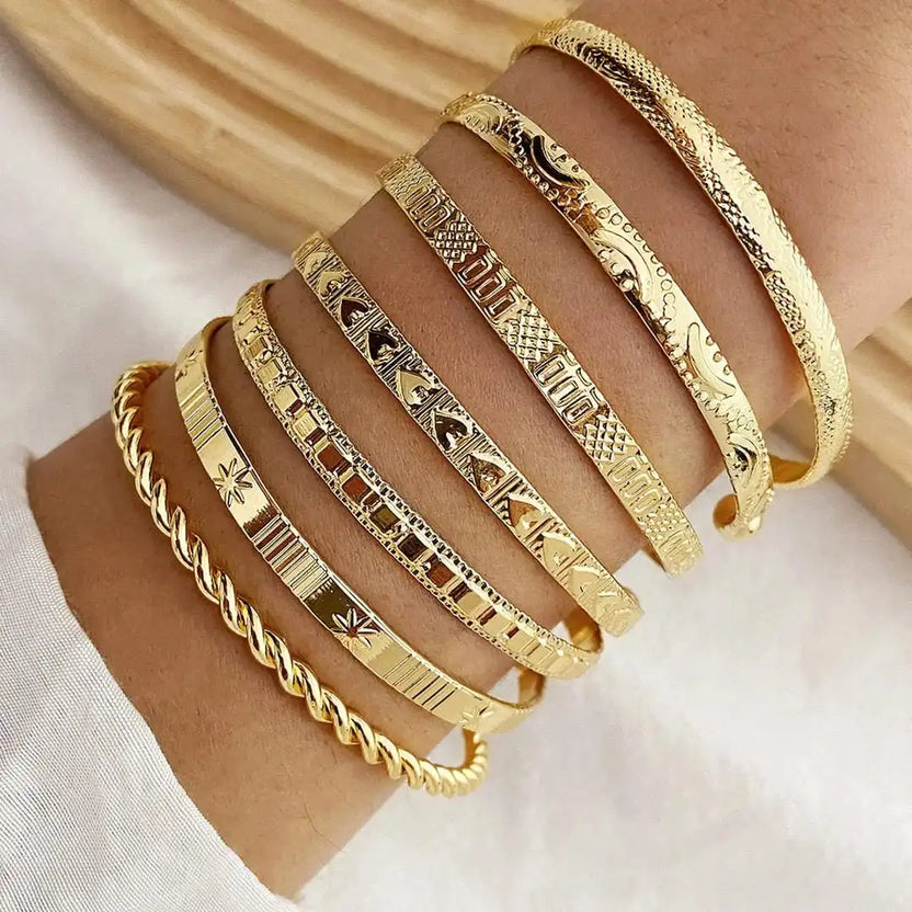 Set de pulseras doradas abiertas estilo resort