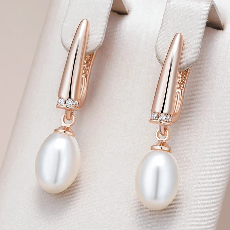 Pendientes elegantes de oro rosa con perla colgante