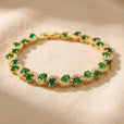 Pulsera dorada de cristal esmeralda