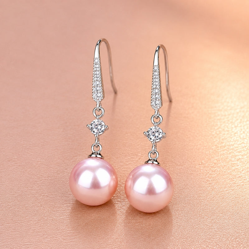 Pendientes exquisitos de perla rosa