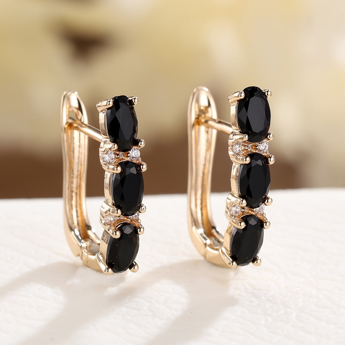 Pendientes colgantes Noir dorado