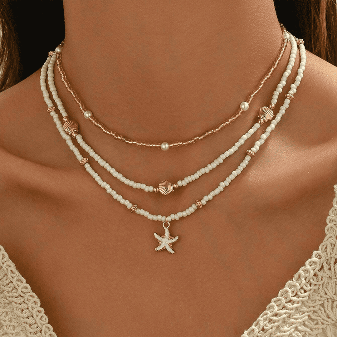 Collar de capas con estrella de mar y cuentas