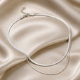 Collar doble de serpiente en oro blanco