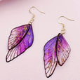 Pendientes largos de resina con alas de mariposa – imagen 3