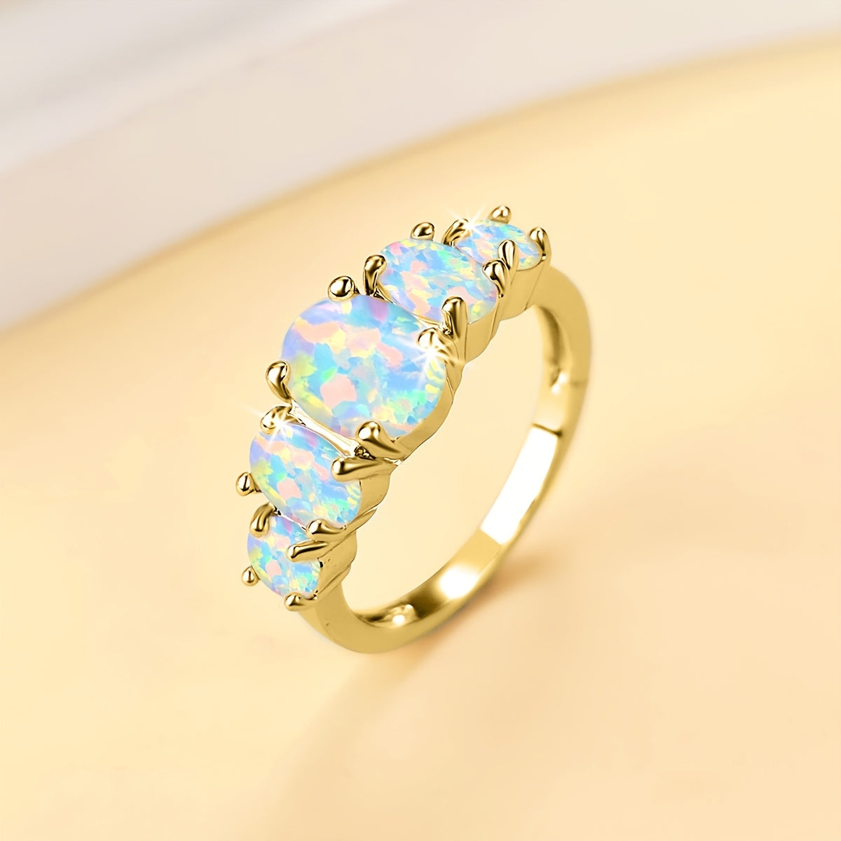Anillo de oro de 18k con cinco ópalos
