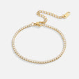 Pulsera tenis dorada atemporal