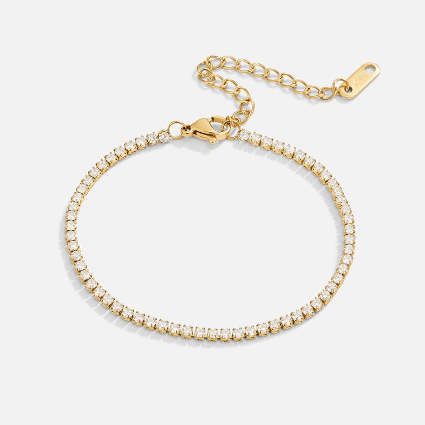 Pulsera tenis dorada atemporal