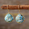 Pendientes bohemios de textura dorada con turquesa