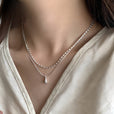 Collar con colgante de doble capa en forma de lágrima en oro blanco – imagen 2