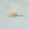 Anillo bicolor con nudo de amor
