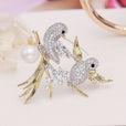 Broche de tórtolas encantadas
