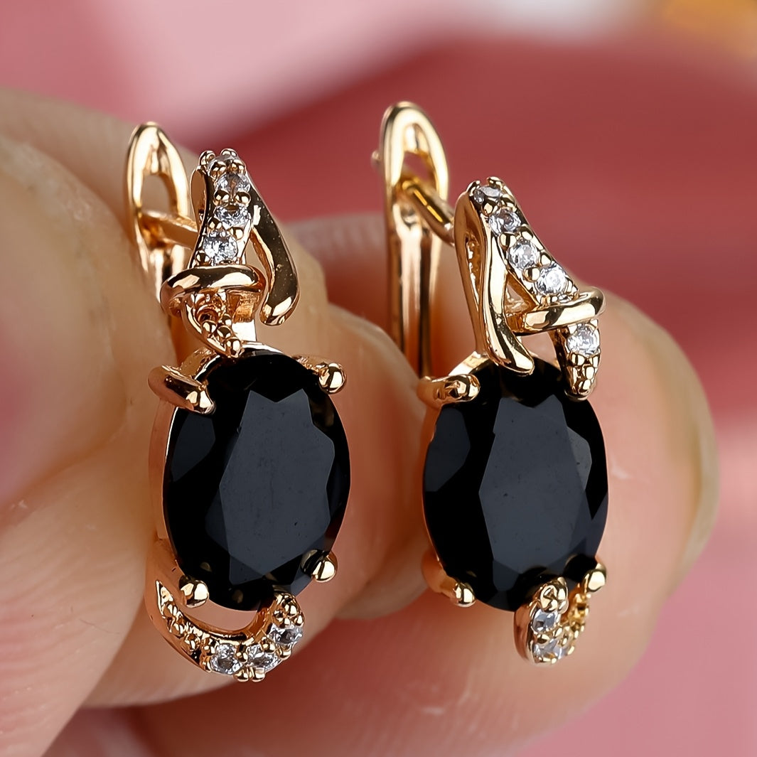 Pendientes dorados de piedra en forma de lágrima