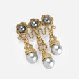 Broche de nudo dorado con perlas
