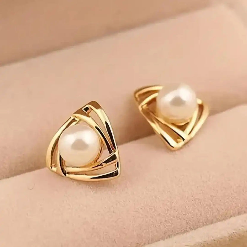 Pendientes exquisitos de perla y oro
