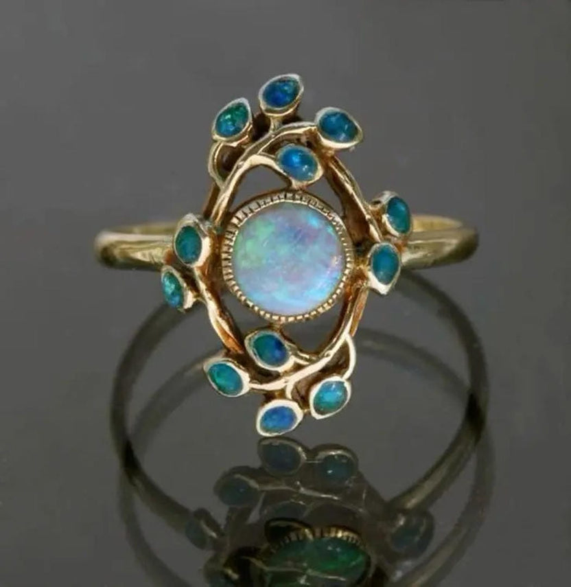 Anillo azul vintage con cristales y ópalo