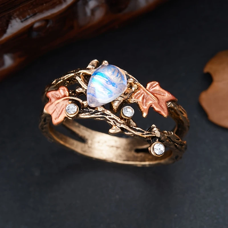 Anillo vintage de piedra de luna con hoja de otoño
