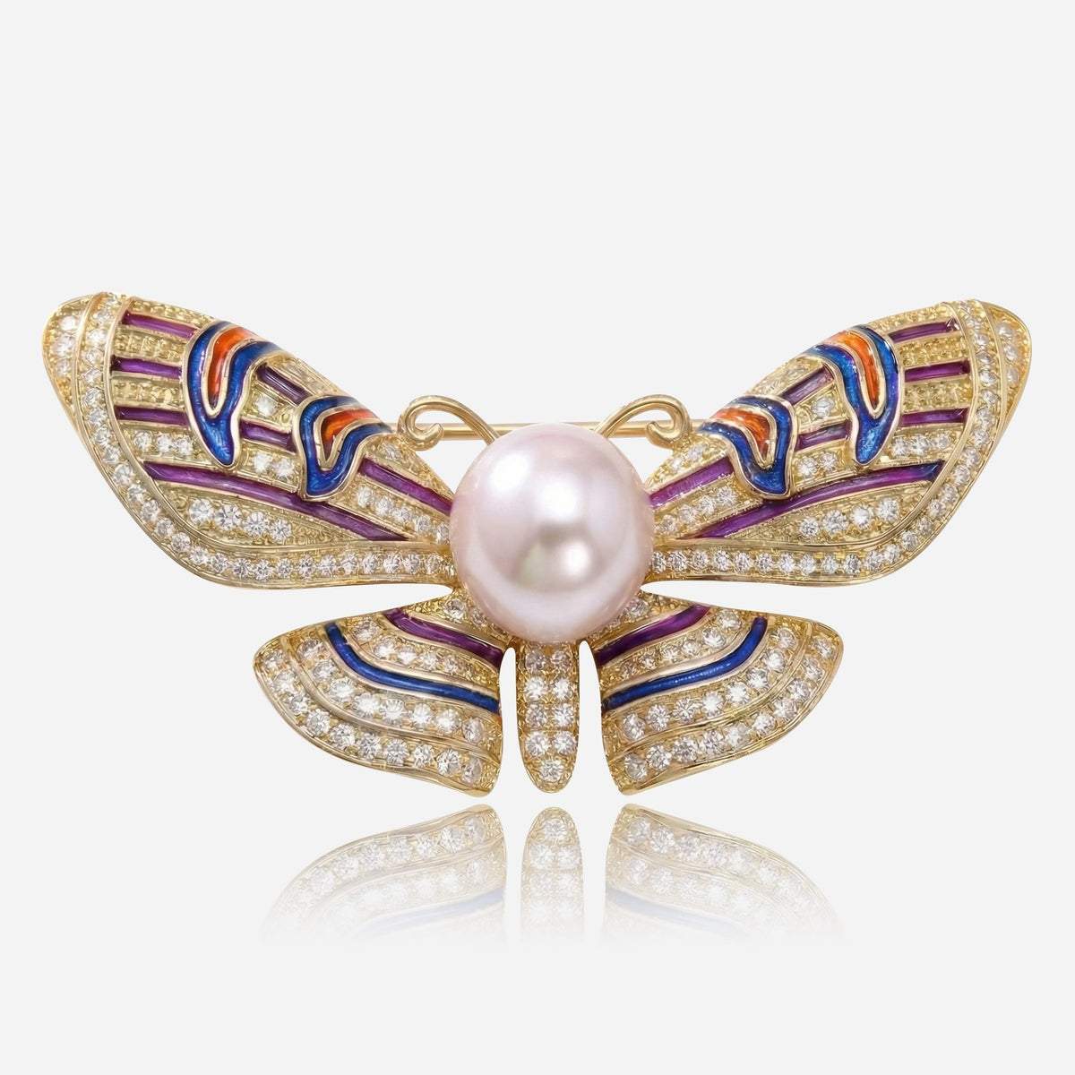 Broche majestuoso con alas de perla