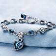 Pulsera de oro blanco con corazón marino luminoso