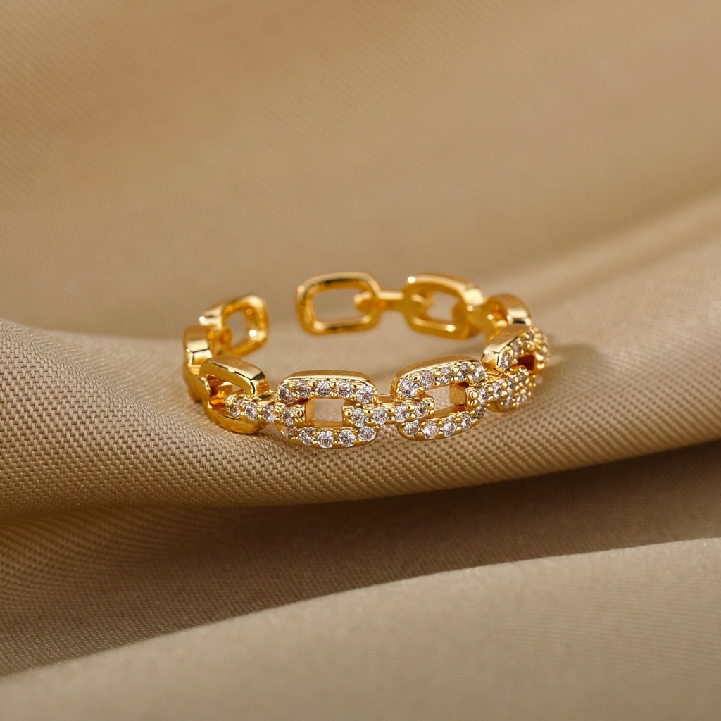 Anillo abierto de cresta dorada
