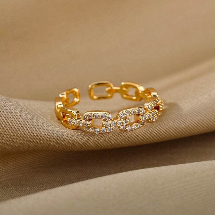 Anillo abierto de cresta dorada
